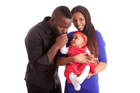 Portrait of a young african american  couple with her baby girlの写真素材