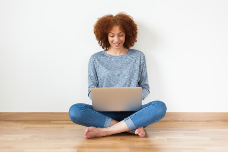 Black African American student girl using a laptopの写真素材