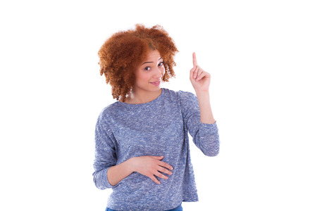 Young african american teenage girl pointing finger up, isolated on white background - black peopleの写真素材