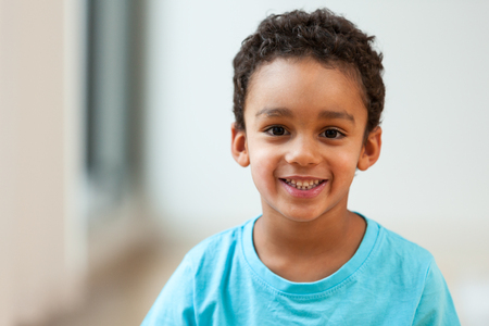 Portrait of a cute little African American boy smilingの写真素材