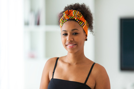 Beautiful African American woman wearing an african head scarf - Black people