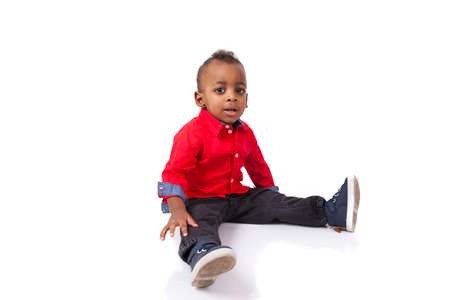 Portrait of a cute african american little boy smiling, isolated on white backgroundの写真素材