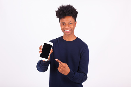 Young African American man pointing his  smartphone screen - Black teenager peopleの写真素材