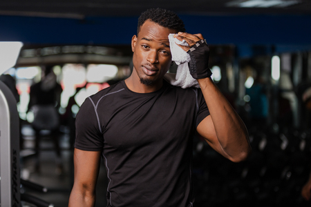 Black African American  young man doing  workout at the gymの写真素材