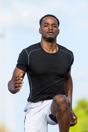 Black african american young man running outdoorの写真素材