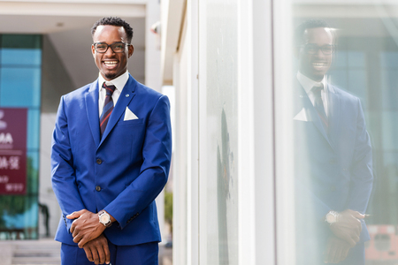 Outdoor standing portrait of a black African American business manの写真素材