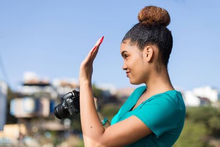 African American woman  photographer taking outdoor photos -  Black peopleの写真素材