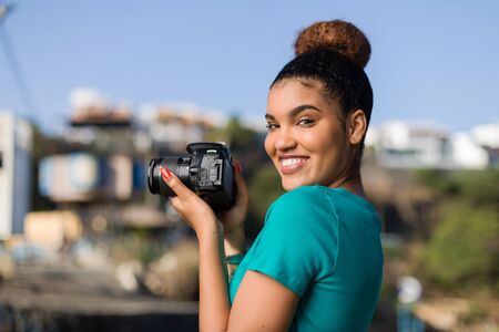 African American woman  photographer taking outdoor photos -  Black peopleの写真素材