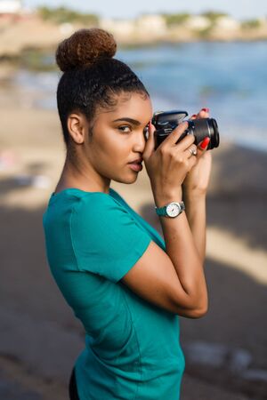 African American woman  photographer taking outdoor photos -  Black peopleの写真素材