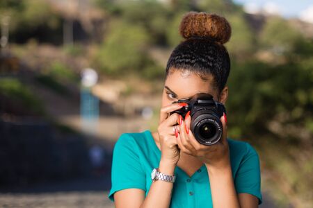 African American woman  photographer taking outdoor photos -  Black peopleの写真素材
