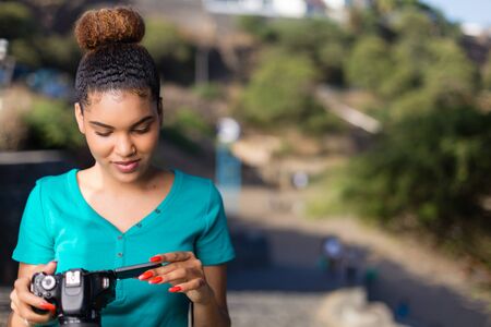 African American woman  photographer taking outdoor photos -  Black peopleの写真素材