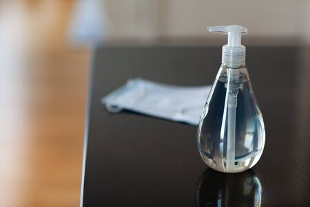 Antibacterial antiseptic hand sanitizer gel bottle and surgical masksの写真素材