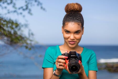 African American woman  photographer taking outdoor photos -  Black peopleの写真素材