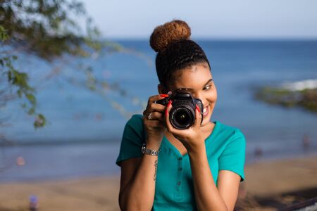 African American woman  photographer taking outdoor photos -  Black peopleの写真素材