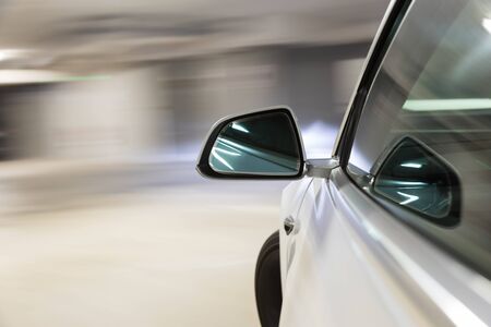 Car light trail while driving in the coty by nightの写真素材