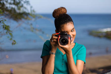 African American woman photographer taking outdoor photos - Black peopleの写真素材