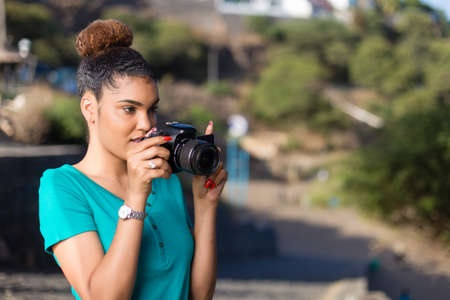 African American woman photographer taking outdoor photos - Black peopleの写真素材