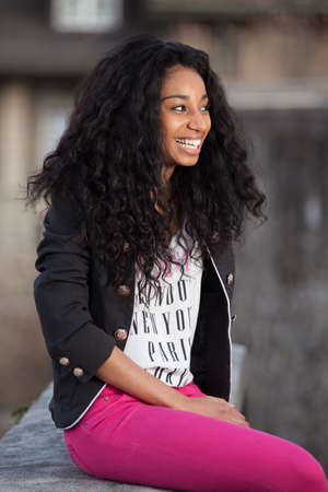 Outdoor of a portrait beautiful young african american teenage girlの写真素材