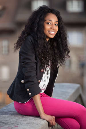 Outdoor of a portrait beautiful young african american teenage girlの写真素材