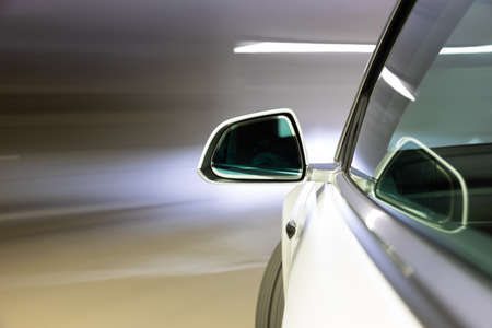 Car light trail while driving in the coty by nightの写真素材