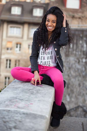 Outdoor of a portrait beautiful young african american teenage girlの写真素材