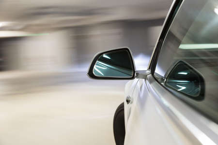 Car light trail while driving in the coty by nightの写真素材