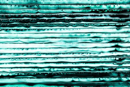 Abstract  background with stack of glass sheets. luminous texture. horizontal viewの写真素材