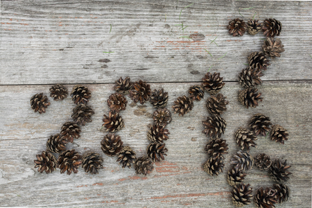 happy new year is coming concept - inscription 2016 and 2017 on old retro vintage wooden background