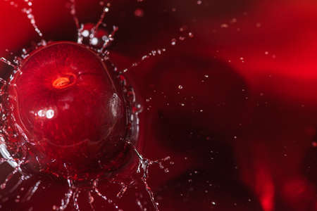 Cherry juice splash with fresh berry. close up shot