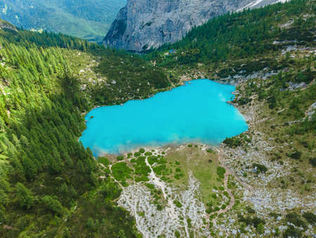 Aerial view of Sorapis Lake in the Dolomites mountains, Cortina d'Ampezzo, Italy. Beautiful Alpine lake Lago di Sorapis. drone shot. Travel destinationの写真素材