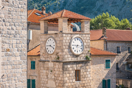 Clock tower in Kotor, Montenegro on Adriatic sea in sunny day. Popular summer vacation destinationの写真素材