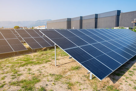 Solar photovoltaic panels in solar farm used to produce mill in a flour mill in Tirana, Albania. Sustainable energy, electric power generation, decarbonization, renewable green energyの写真素材