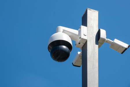 Security CCTV camera monitoring system with panoramic view outdoor against blue sky. Safety system....