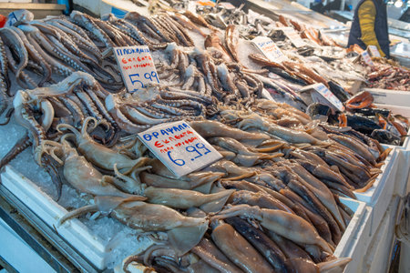 Athens, Greece - 4 December 2023: Central seafood market with displays and counters with squids, octopuses and fish in Athens, Greece. Retail place o healthy foodのeditorial素材