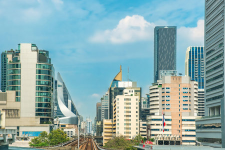 View of Bangkok modern skyscrapers, high-rise buildings and monorail rail road, showcasing urban...