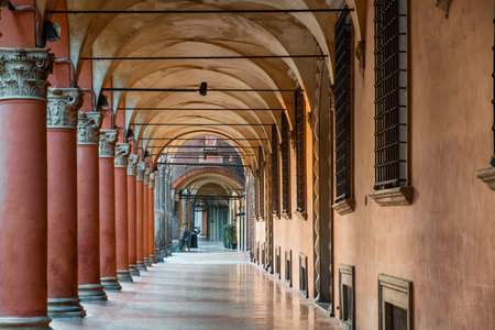 Portico columns on Piazza Santo Stefano in Bologna old town, Emilia Romagna, Italy. Porticoes arched walkway. Travel destination in Europeの写真素材