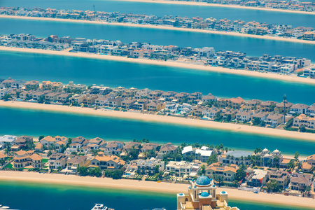 Aerial view of luxury villas on The Palm Jumeirah artificial island with sandy beach and turquoise waters of Arabian Gulf n Dubai city, United Arab Emiratesの写真素材