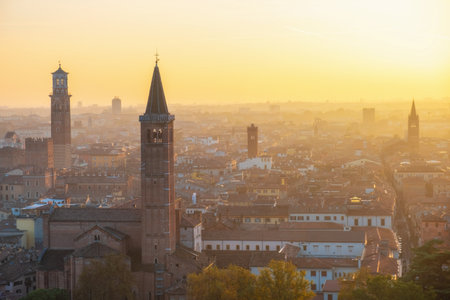 Aerial sunset view of Verona old town with Basilica di Santa Anastasia, Lamberti tower, medieval architecture, Veneto, Italy. Italian cityscape. Travel destination in Europeの写真素材