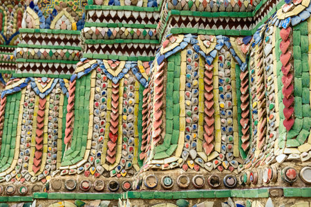 Close-up of intricate mosaic tile patterns and gilded carvings from Wat Phra Kaew, Temple of the...
