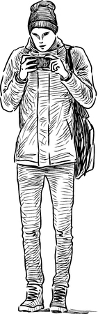 A teen boy with a mobile phoneのイラスト素材