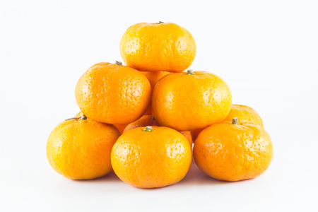 Many fresh raw orange isolated on white backgroundの写真素材