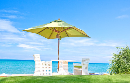 Beach Umbrella And Sunbath Seats In A Tropical Beach Hotel That Located In Costal Area Negambo, Sri Lankaのeditorial素材