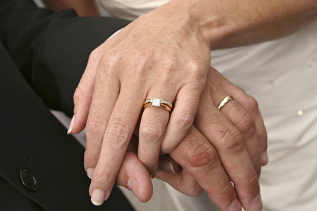 hands with wedding ringsの写真素材