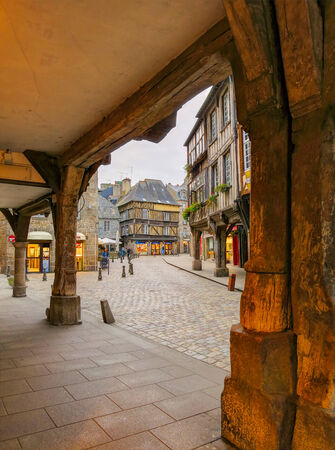Center of medieval city Dinan, seen from between old wooden pillars, Franceの写真素材