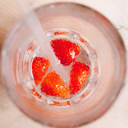 Strawberry drink with straws, closeup from aboveの写真素材