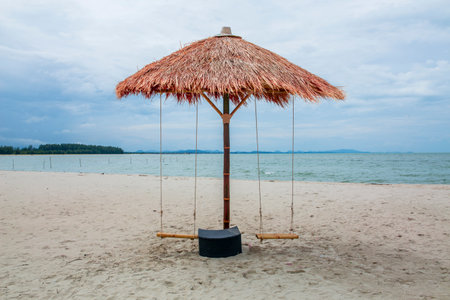 Chairs on the sandy beach near the sea. Summer holiday and vacation concept for tourism. Inspirational tropical landscape.The sea has no tourists.の写真素材
