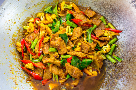 Stir fried meat with vegetables in wok, Thai food.の写真素材