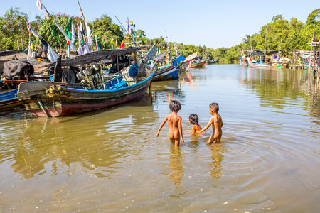 Unidentified children playing in the river.