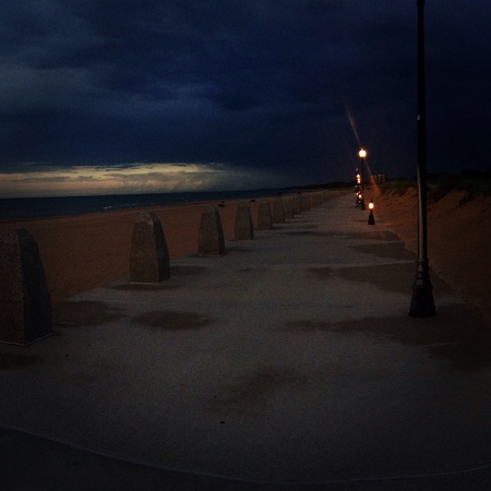 The natural sky of the beach as a storm is about to roll in. の素材