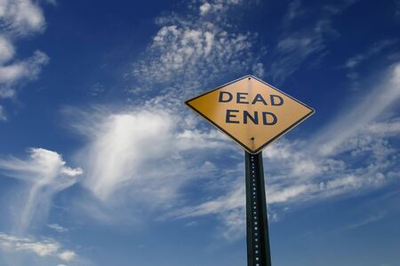Old Dead End sign against a cloudy sky. A way to Heaven.の写真素材